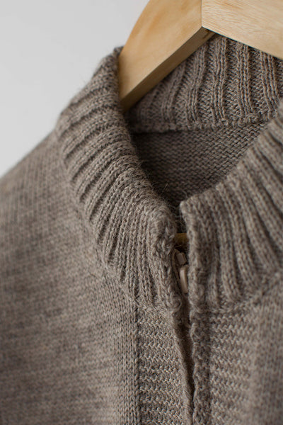 Beige Zipped Guernsey Jacket on a wooden hanger