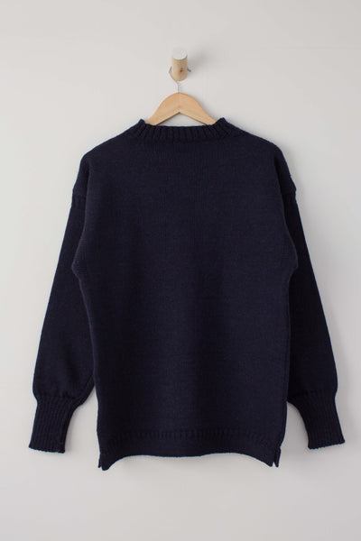 Navy Blue Traditional Guernsey Fishermans Jumper on a wooden hanger