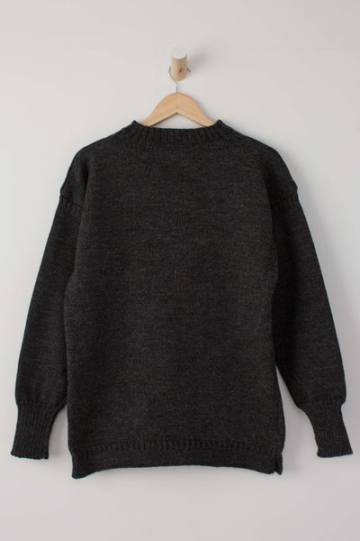 Dark Grey Traditional Guernsey Jumper hanging on a wooden hanger