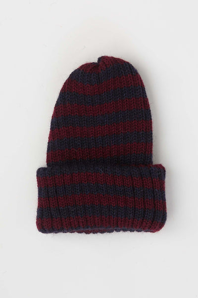 Close up of navy & burgundy striped beanie hat 