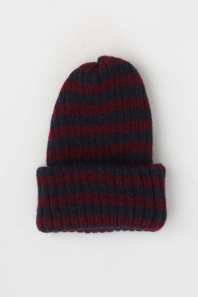 Close up of navy & burgundy striped beanie hat