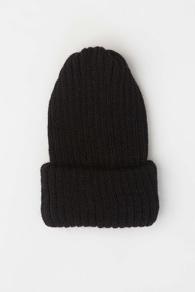 close up on black knitted beanie