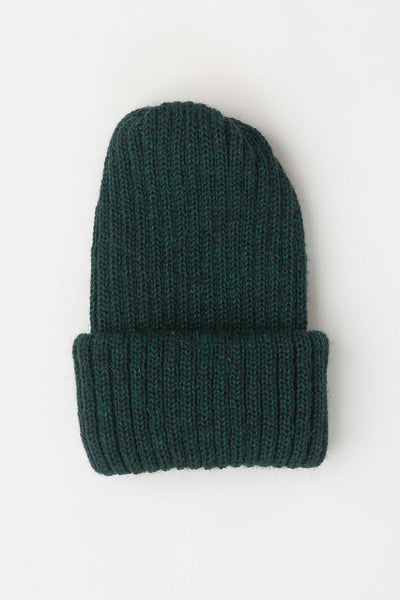 close up of dark green knitted beanie