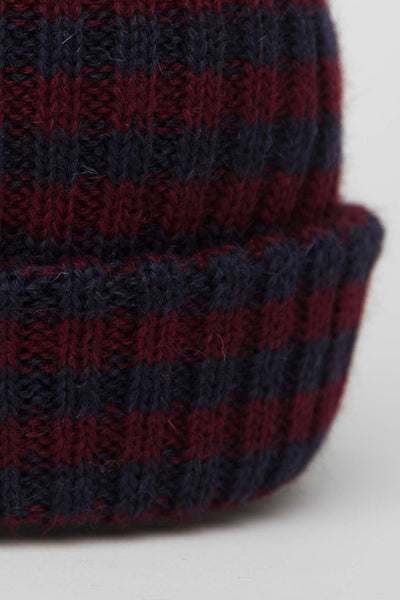 Close up of navy & burgundy striped beanie hat