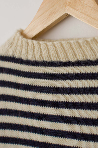 Cream & Navy Striped Traditional Guernsey Fishermans Sweater on a wooden hanger