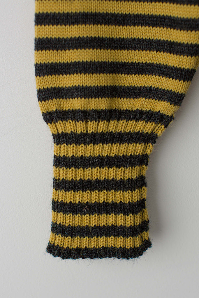 Open cuff detail on a Charcoal & Mustard Striped Traditional Guernsey
