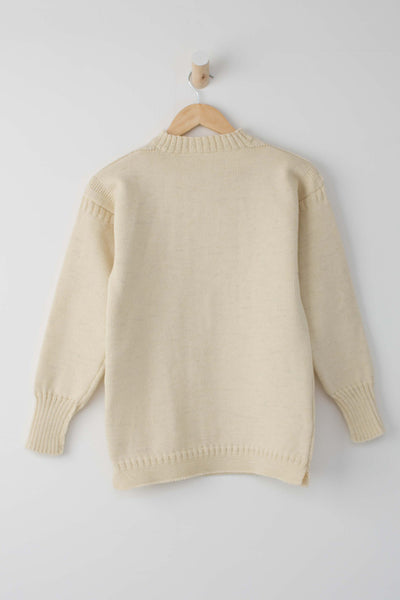 cream knitted guernsey jumper hanging up
