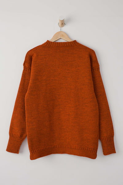 Burnt Orange Traditional Guernsey Jumper on wooden hanger