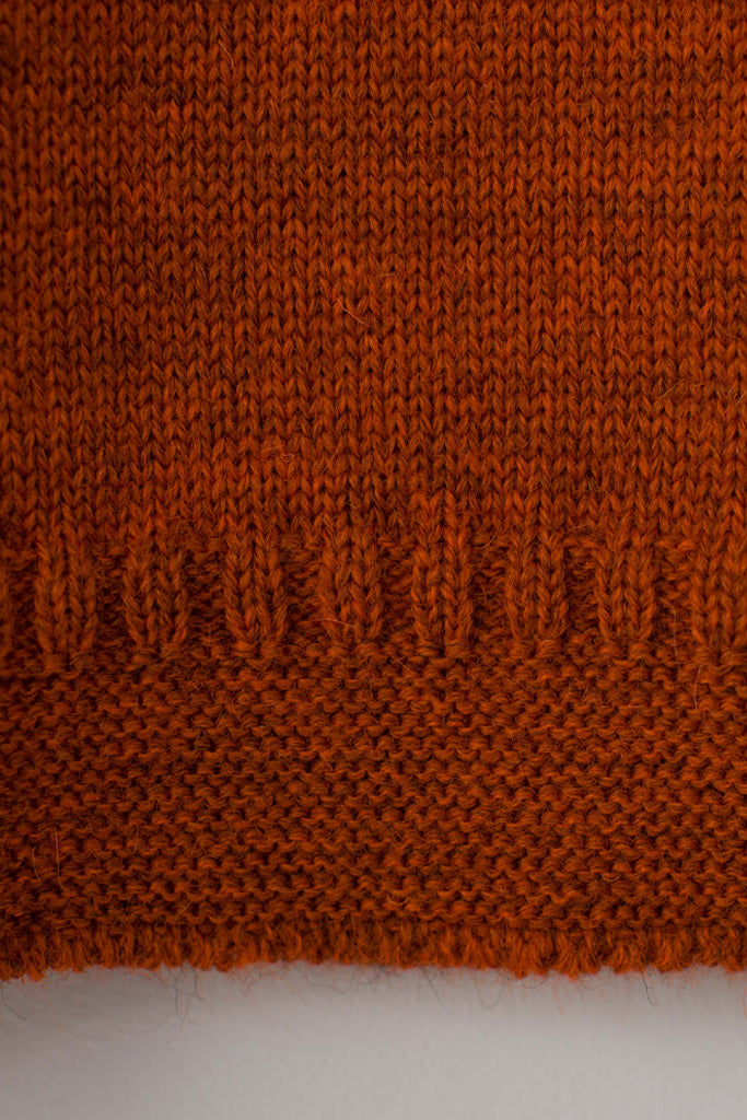 Hem detail on a Burnt Orange Traditional Guernsey