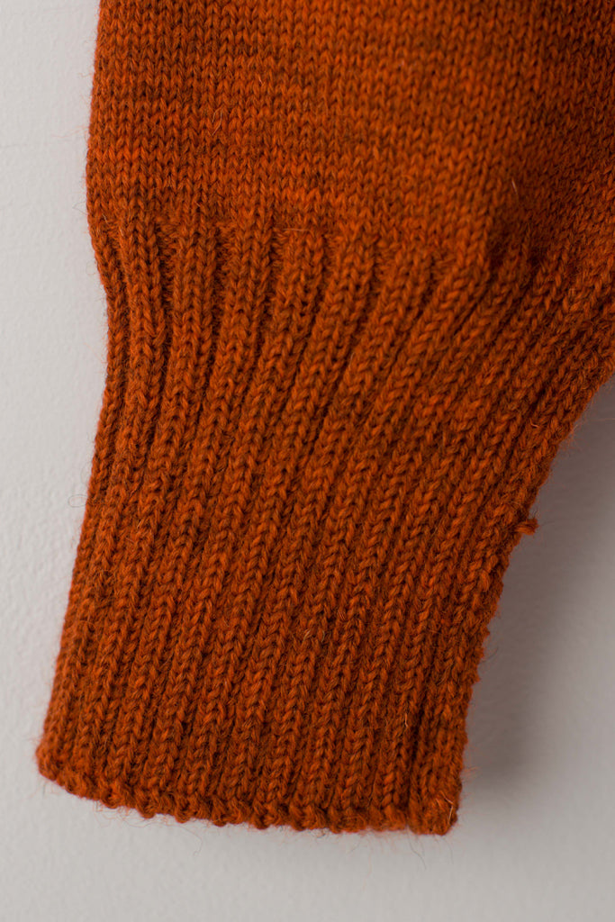 Open cuff detail on a Burnt Orange Traditional Guernsey