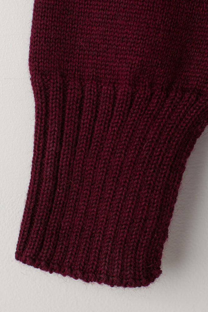 Open cuff detail on a  Burgundy Traditional Guernsey