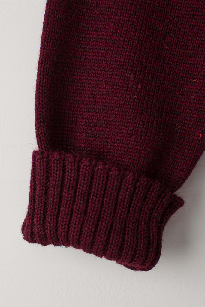 Folded cuff detail on a Burgundy Traditional Guernsey 