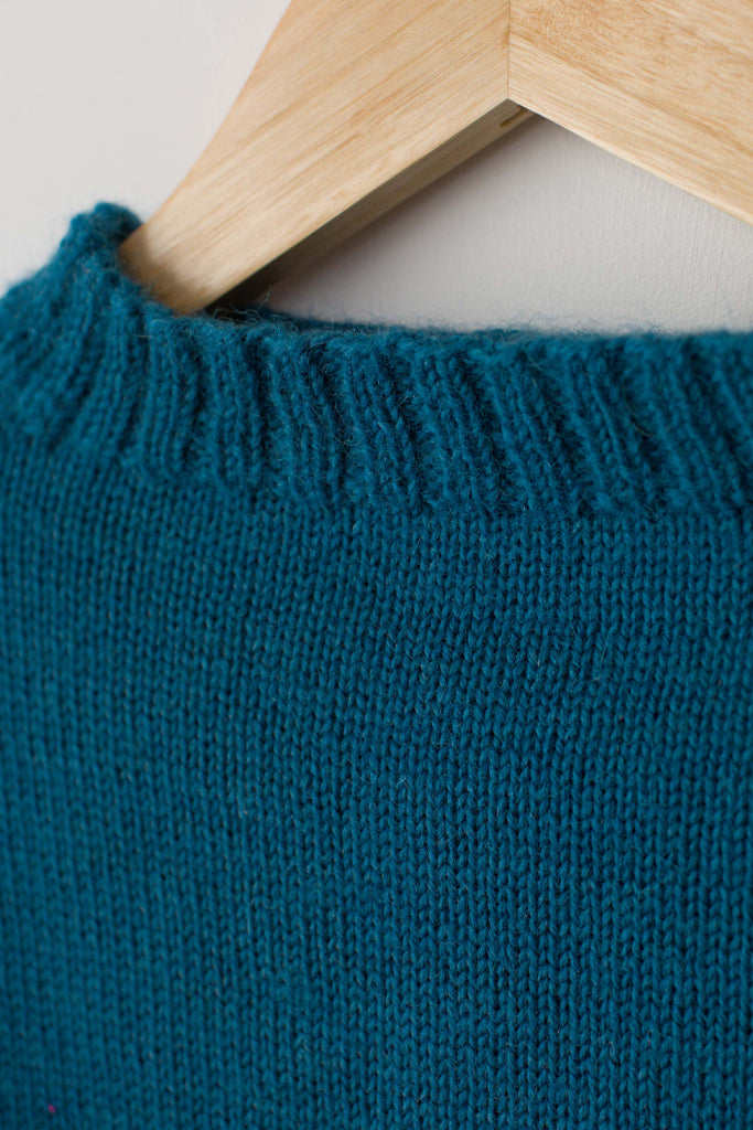 Neck detail on a Kingfisher Blue Traditional Guernsey