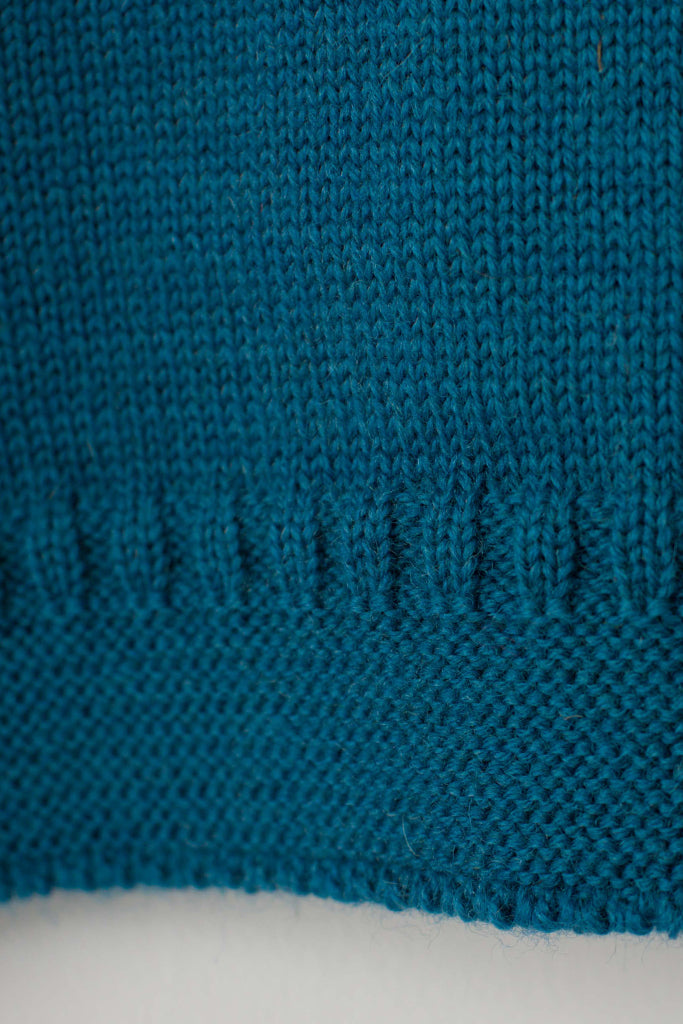 Hem detail on a Kingfisher Blue Traditional Guernsey