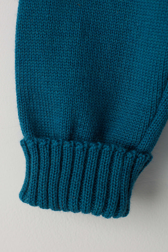 Folded cuff detail on a Kingfisher Blue Traditional Guernsey