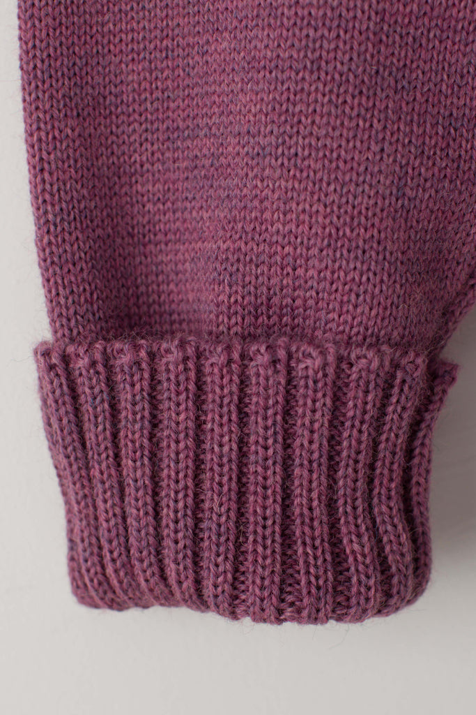 Folded cuff detail on a Lupin Pink Traditional Guernsey