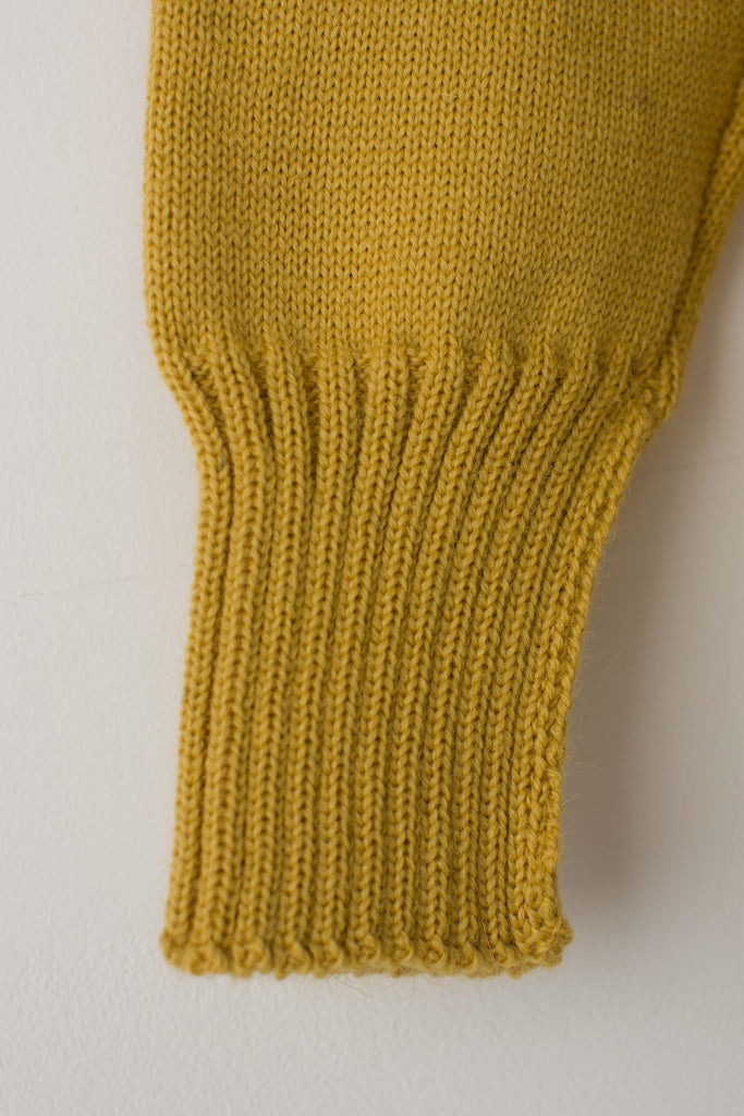 Open cuff detail on a Mustard Traditional Guernsey