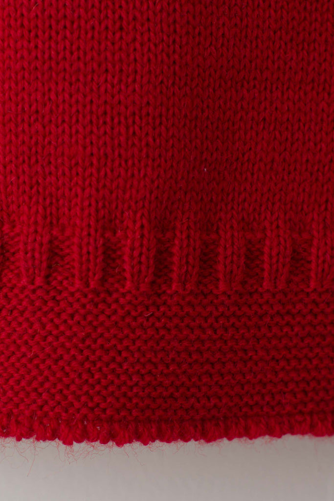 Hem detail on a Tartan Red Zipped Guernsey Jacket