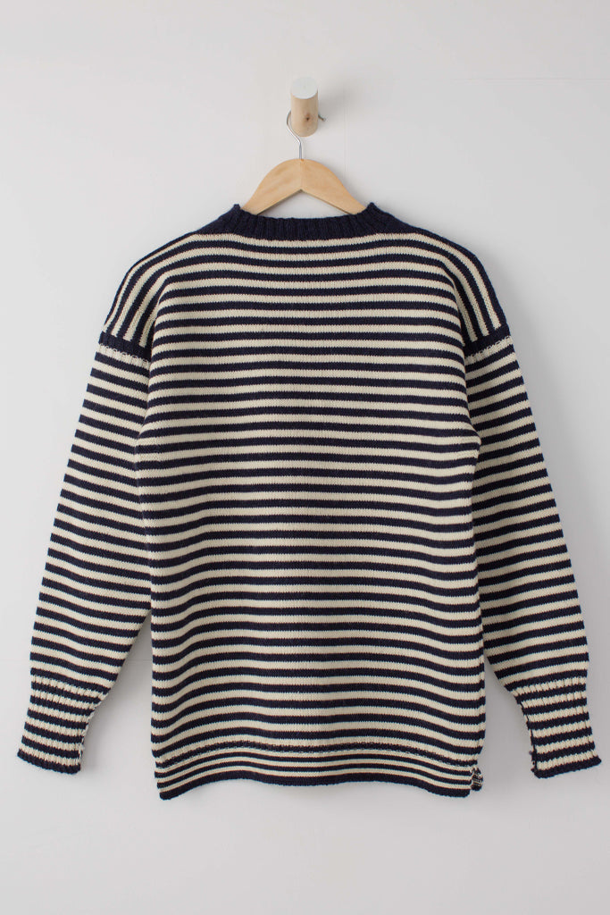 Navy and Cream striped guernsey hanging on a wooden hanger