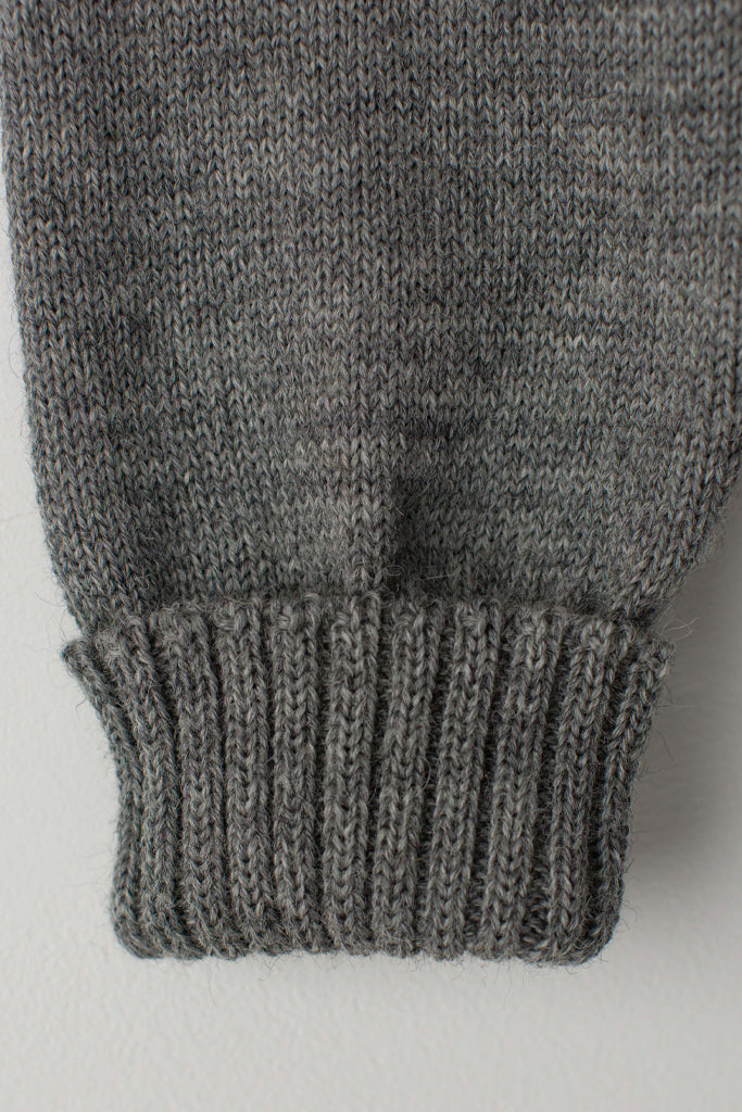 Folded cuff detail on a Mid Grey Traditional Guernsey