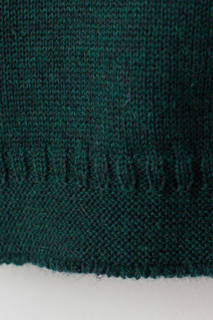Hem detail on a Men's Dark Green Traditional Guernsey