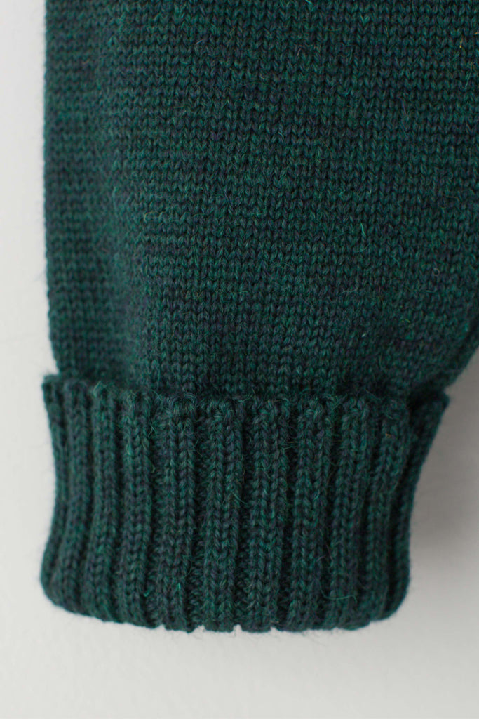Folded cuff detail on a Men's Dark Green Traditional Guernsey