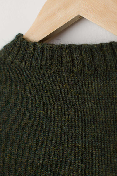 Military Green Traditional Guernsey Jumper on a wooden hanger