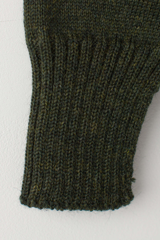 Open cuff detail on a Military Green Traditional Guernsey