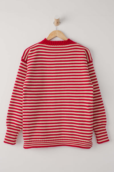 Red and Cream traditional guernsey jumper hanging on a wooden hanger