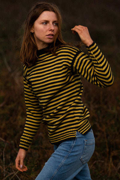 Charcoal & Mustard Striped Traditional Guernsey Jumper on a hanger