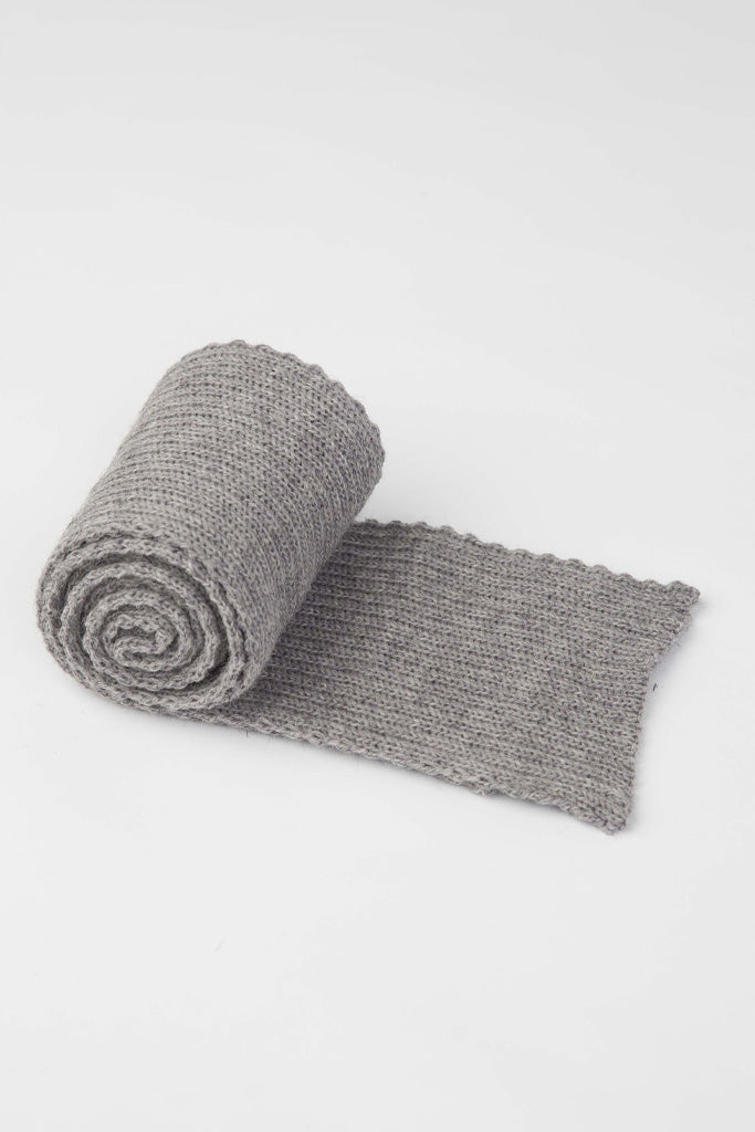 Rolled up Smoky Grey knitted scarf