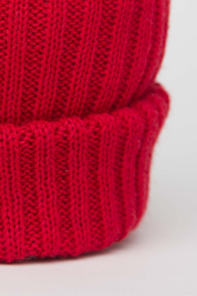 Close up of a Tartan Red Knitted Beanie
