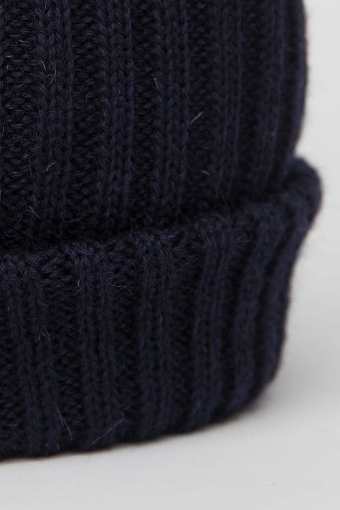 Close up of the brim of the Navy Knitted Beanie