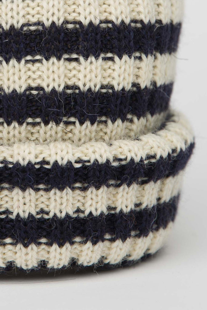 close up of Navy and Cream striped beanie