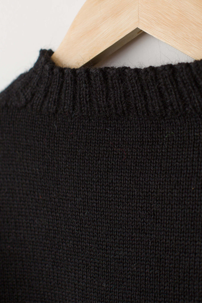 Neck detail on a traditional black guernsey