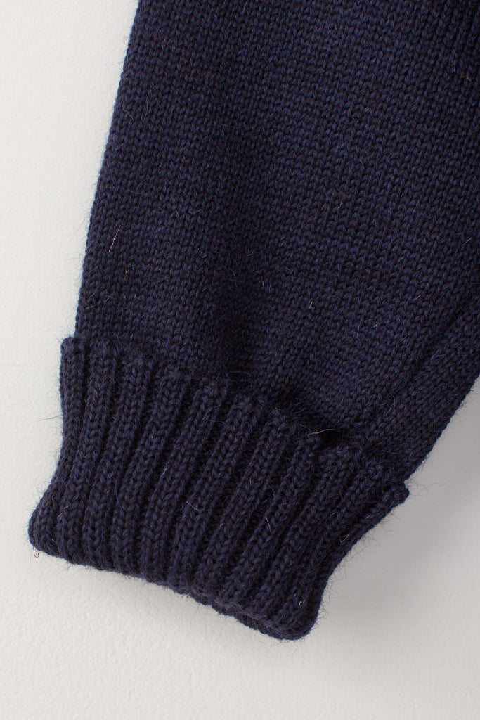 Folded cuff detail on a Navy Blue Traditional Guernsey