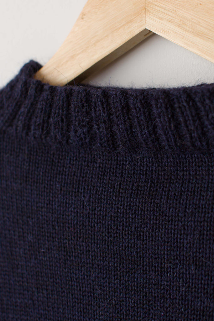 Neck detail on a  Navy Blue Traditional Guernsey