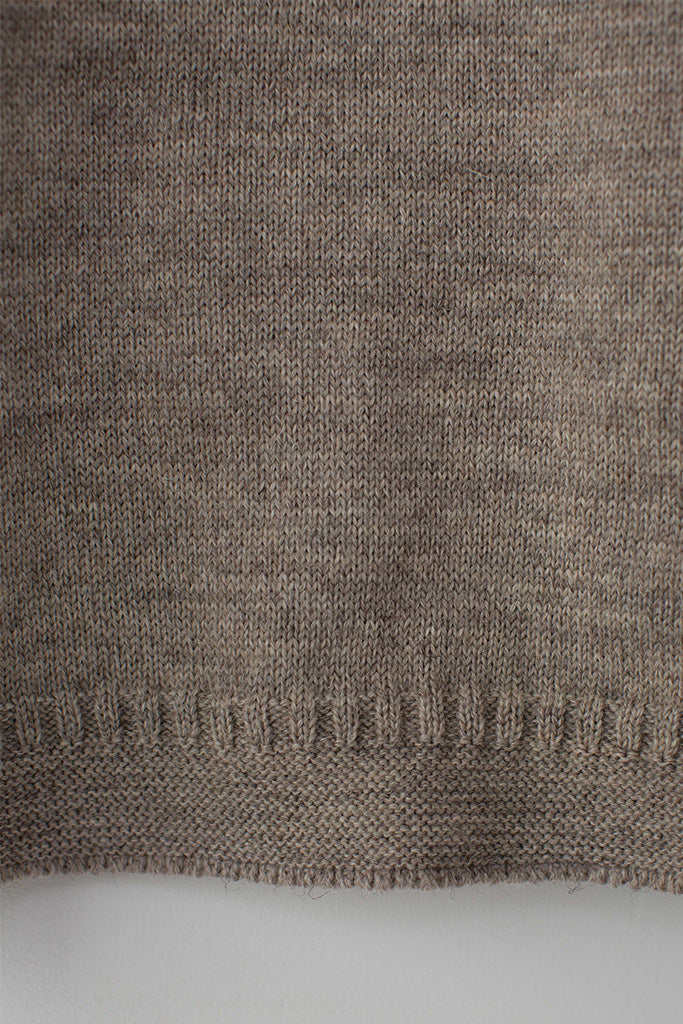 Hem detail on a Beige Traditional Guernsey