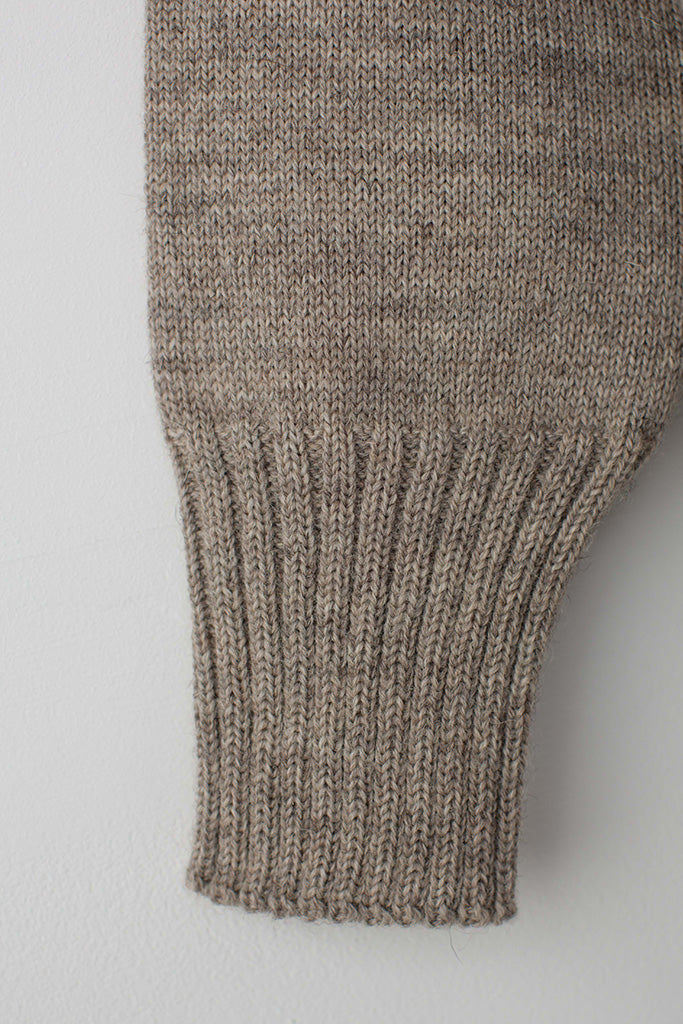 Open cuff detail on a Beige Traditional Guernsey