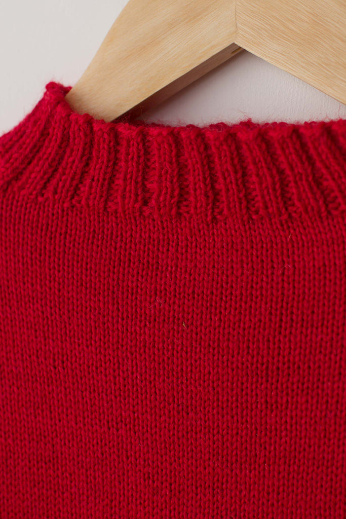 Neck detail on a Tartan Red Traditional Guernsey